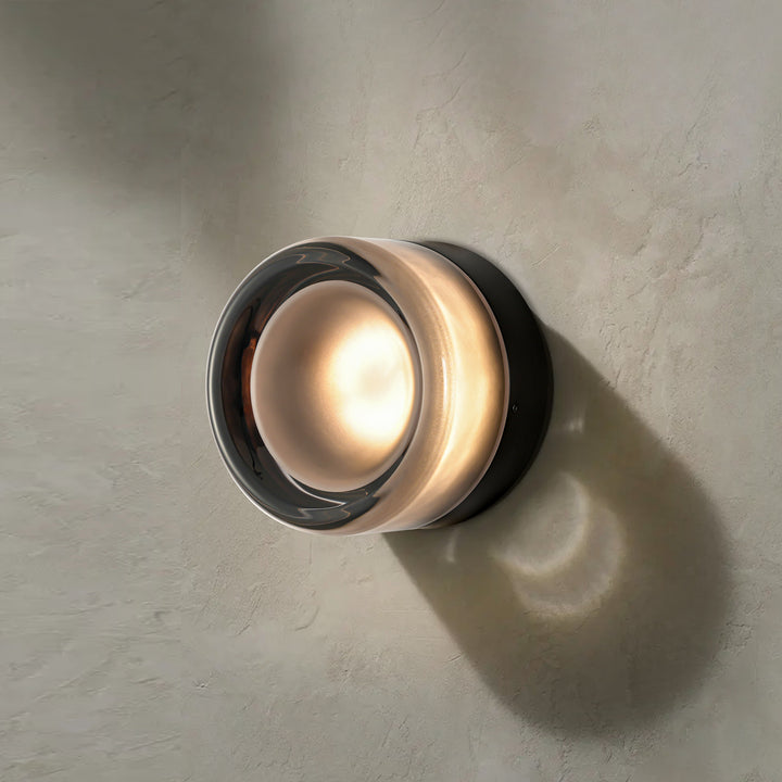 Adorn your walls with the Modern Minimalist Round Dimple Wall Lamp, a masterpiece of understated elegance. Its circular form and subtle dimpled texture create a harmonious interplay of light and shadow. This round acrylic lamp’s refined simplicity and diffused glow elevate contemporary interiors, offering both style and tranquility to your living environment.