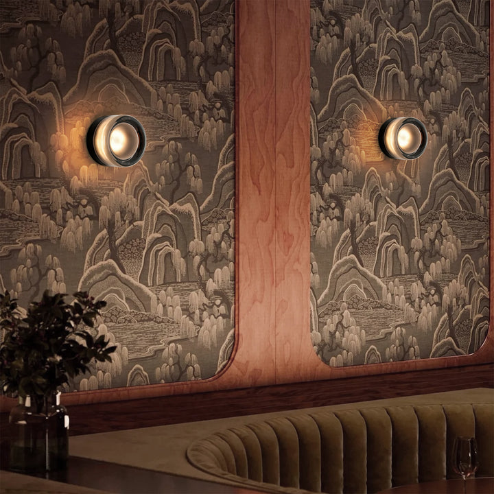 Adorn your walls with the Modern Minimalist Round Dimple Wall Lamp, a masterpiece of understated elegance. Its circular form and subtle dimpled texture create a harmonious interplay of light and shadow. This round acrylic lamp’s refined simplicity and diffused glow elevate contemporary interiors, offering both style and tranquility to your living environment.